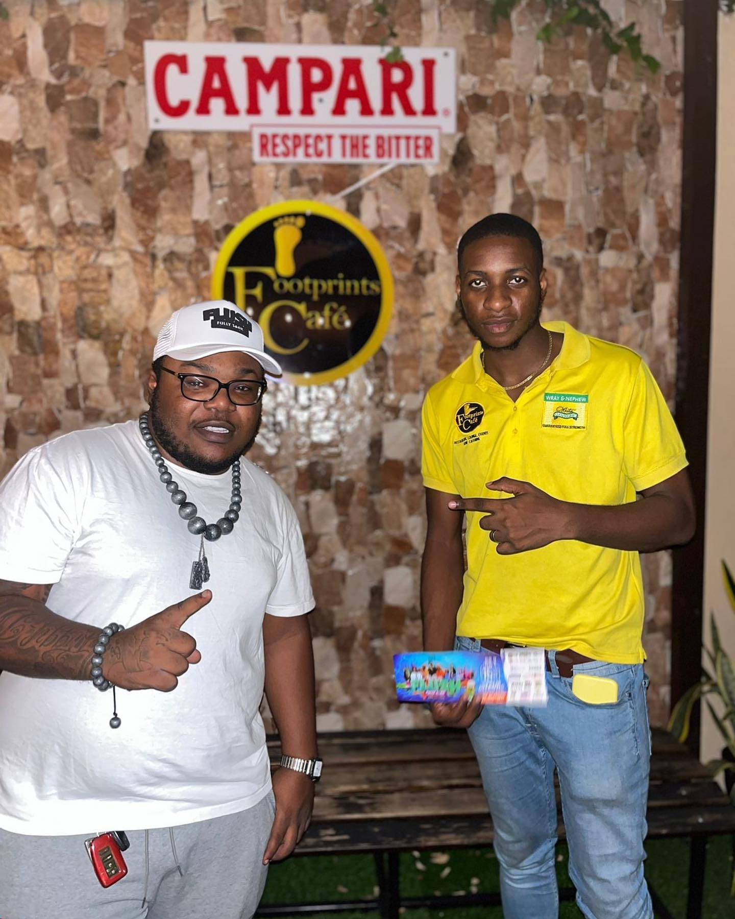 Bradly Clarke with patron at Footprints Cafe